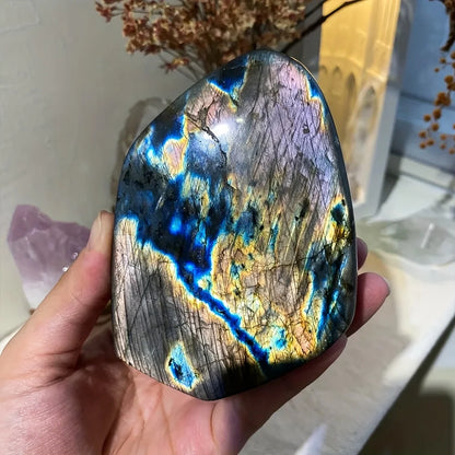 One Bohemian-style rainbow labradorite crystal sculpture - a free-form, three-dimensional gemstone with iridescent emerald hues